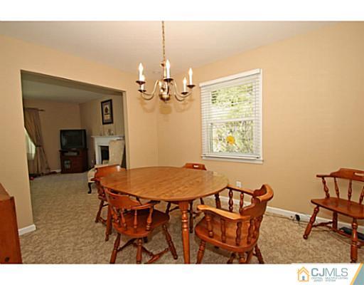 18 Dorian Road Metuchen, NJ 08840 - Photo 5 of 25 a view of a dining room with furniture and a chandelier