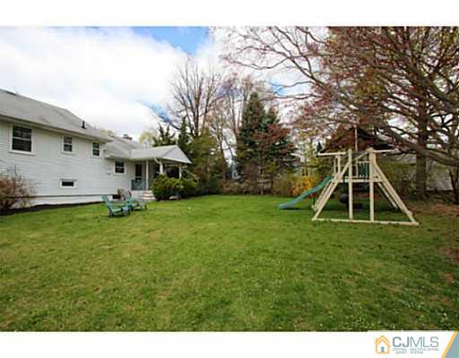 18 Dorian Road Metuchen, NJ 08840 - Photo 8 of 25 a view of a house with a backyard