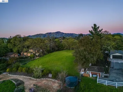 an aerial view of residential house with outdoor space