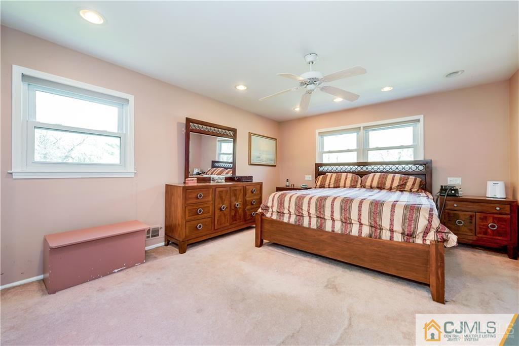 25 Timber Road East Brunswick, NJ 08816 - Photo 14 of 22 a bed room with furniture and a window