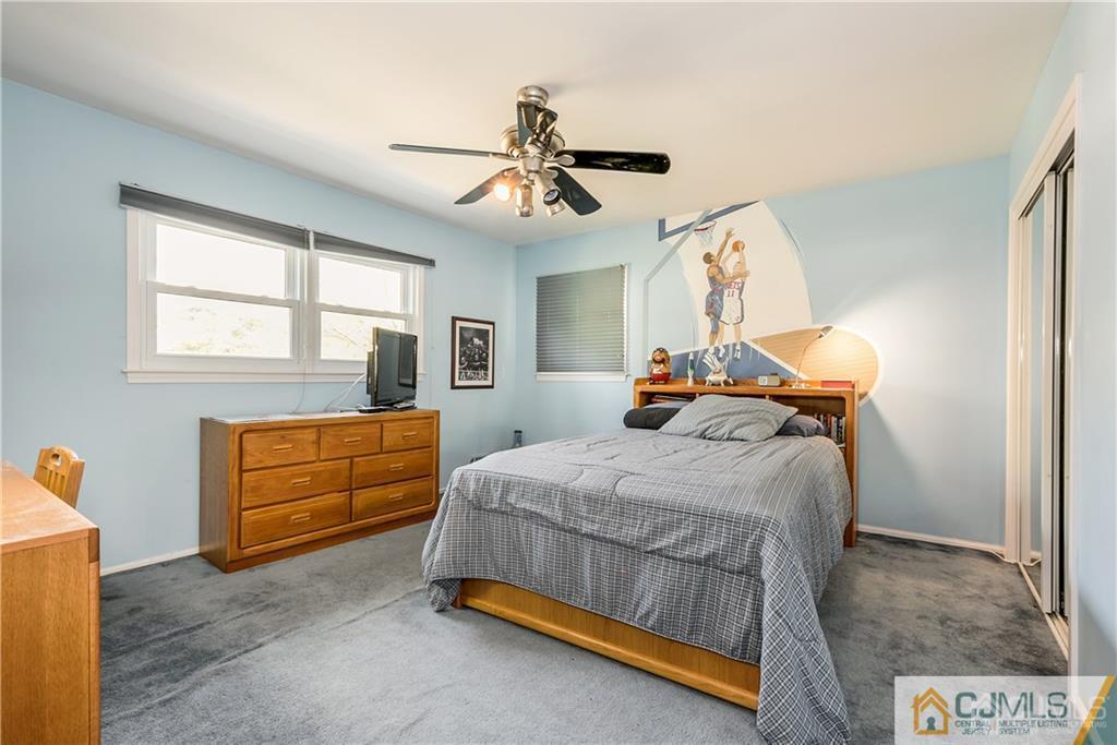 25 Timber Road East Brunswick, NJ 08816 - Photo 15 of 22 a bedroom with a bed and wooden floor