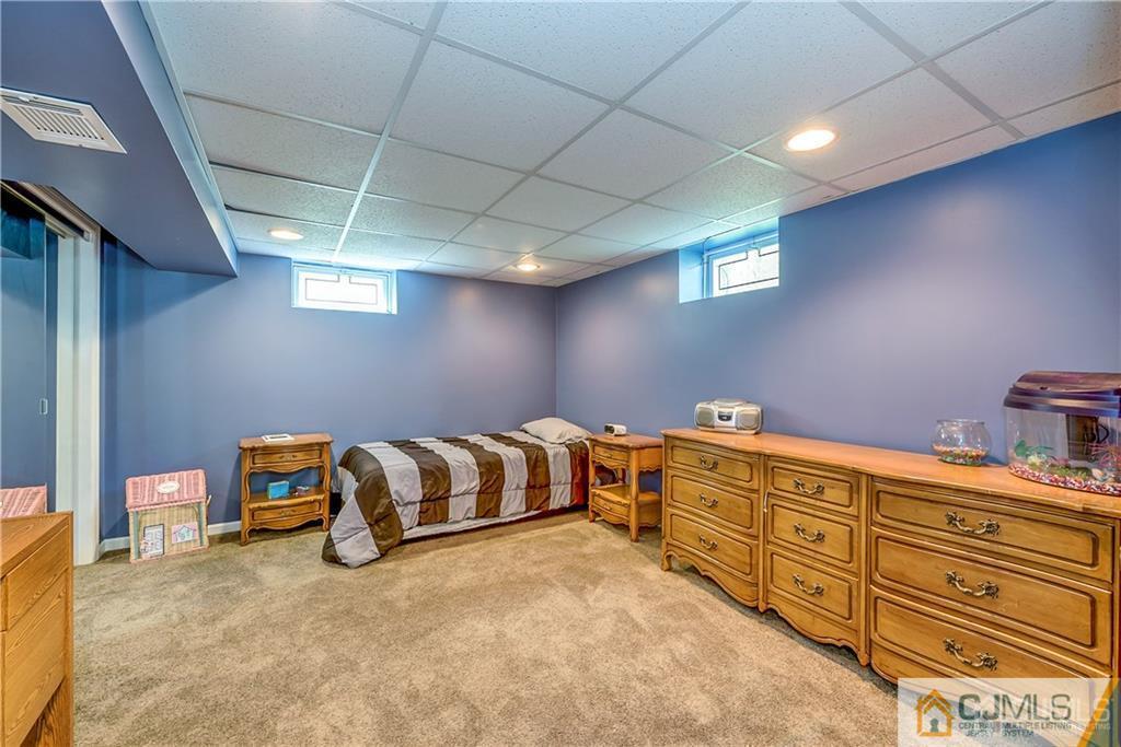 25 Timber Road East Brunswick, NJ 08816 - Photo 18 of 22 a room with storage and furniture