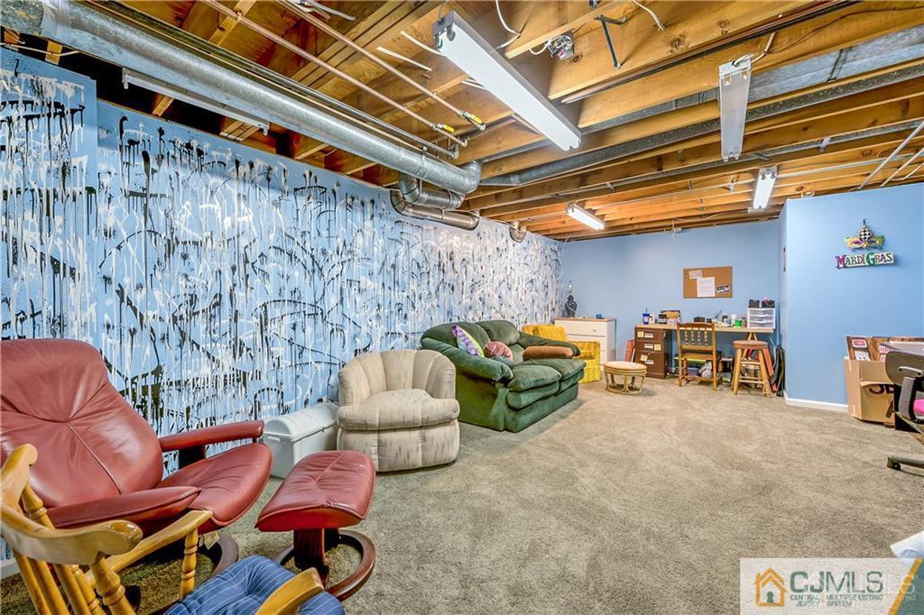 25 Timber Road East Brunswick, NJ 08816 - Photo 19 of 22 a living room with furniture and a ceiling fan