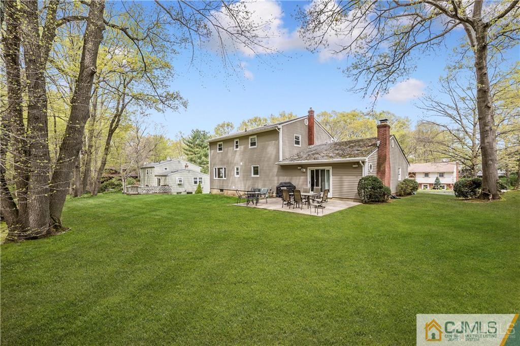 25 Timber Road East Brunswick, NJ 08816 - Photo 22 of 22 a view of a big house with a big yard and large trees