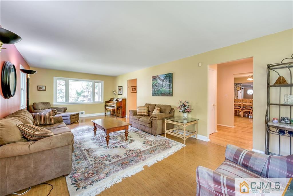 25 Timber Road East Brunswick, NJ 08816 - Photo 6 of 22 a living room with furniture or couch and a wooden floor