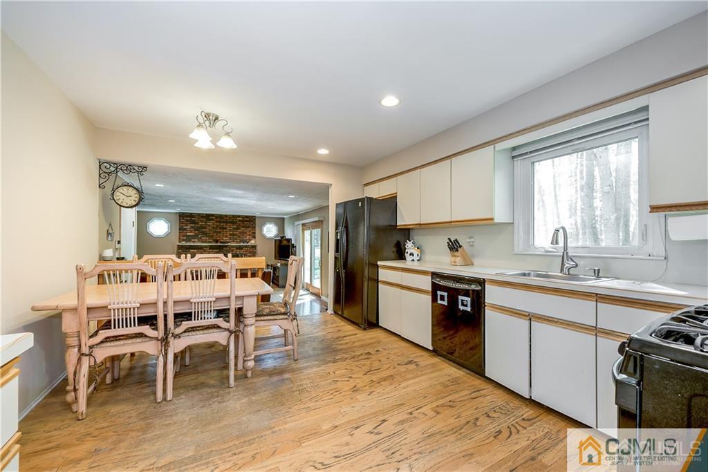 25 Timber Road East Brunswick, NJ 08816 - Photo 8 of 22 a large kitchen with kitchen island a sink table and chairs