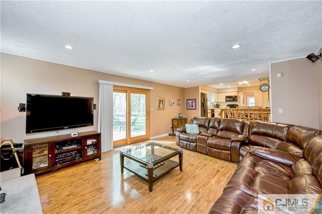 25 Timber Road East Brunswick, NJ 08816 - Photo 10 of 22 a living room with furniture and a flat screen tv