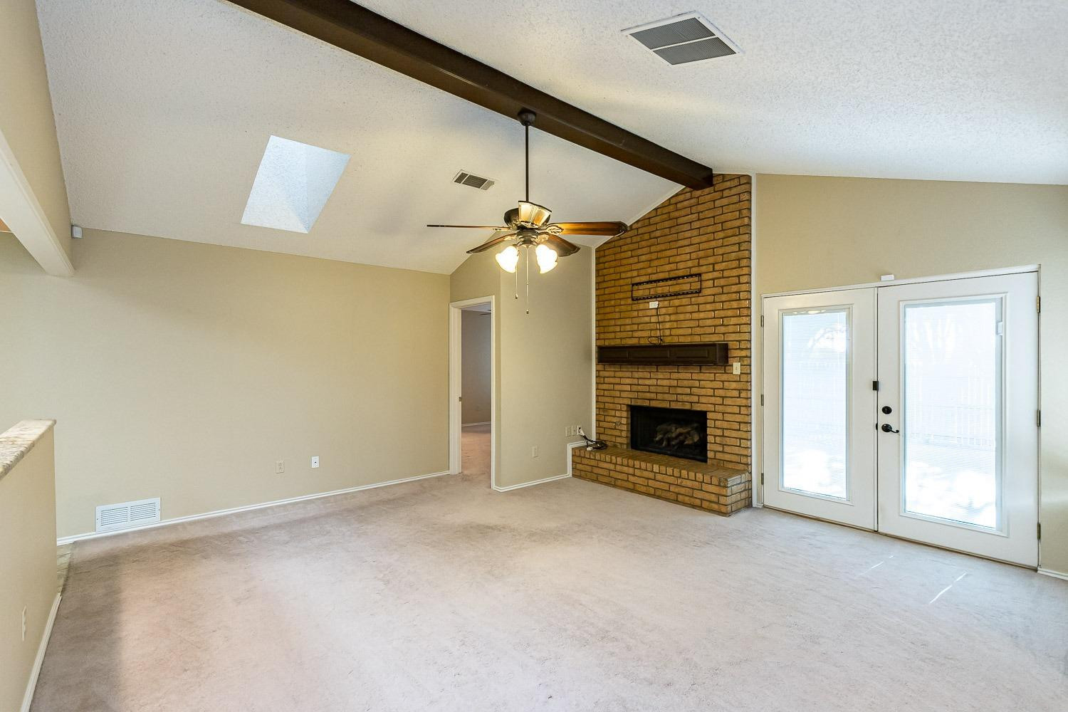 3202 66th Street, Unit A Lubbock, TX 79413 - Photo 5 of 37 Beamed and Vaulted Ceiling