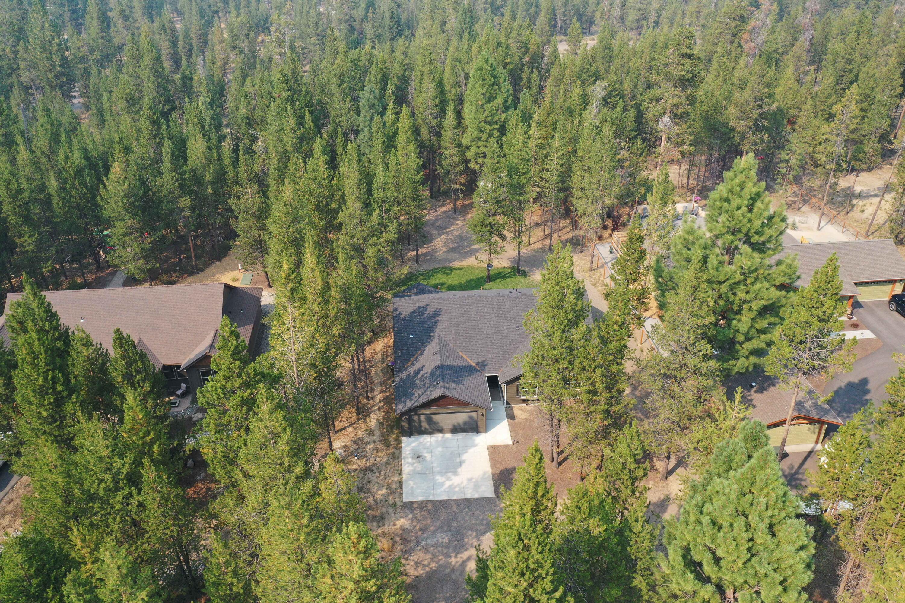 17160 Elsinore Road Bend, OR 97707 - Photo 33 of 47 an aerial view of a house with a yard and tree s