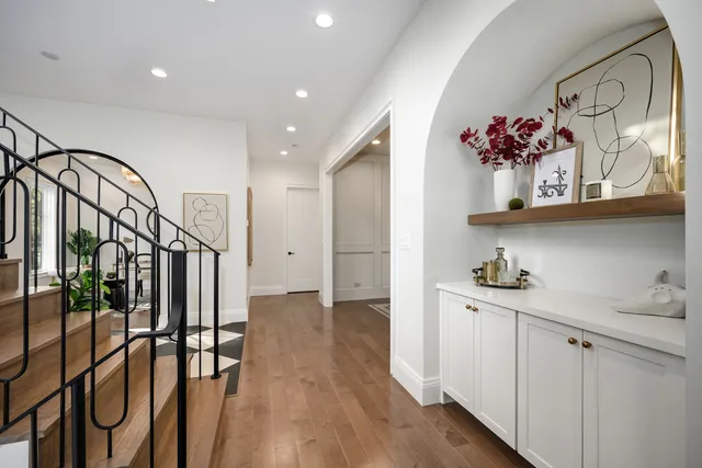 a view of a dining room with furniture and wooden floor