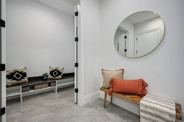 a bathroom with a shower a toilet and a sink