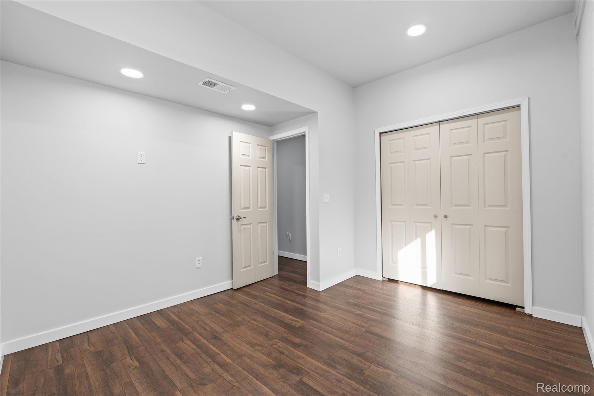 7670 Mi State Road Manchester, MI 48158 - Photo 12 of 53 Unfurnished bedroom featuring recessed lighting, dark wood finished floors, and a closet