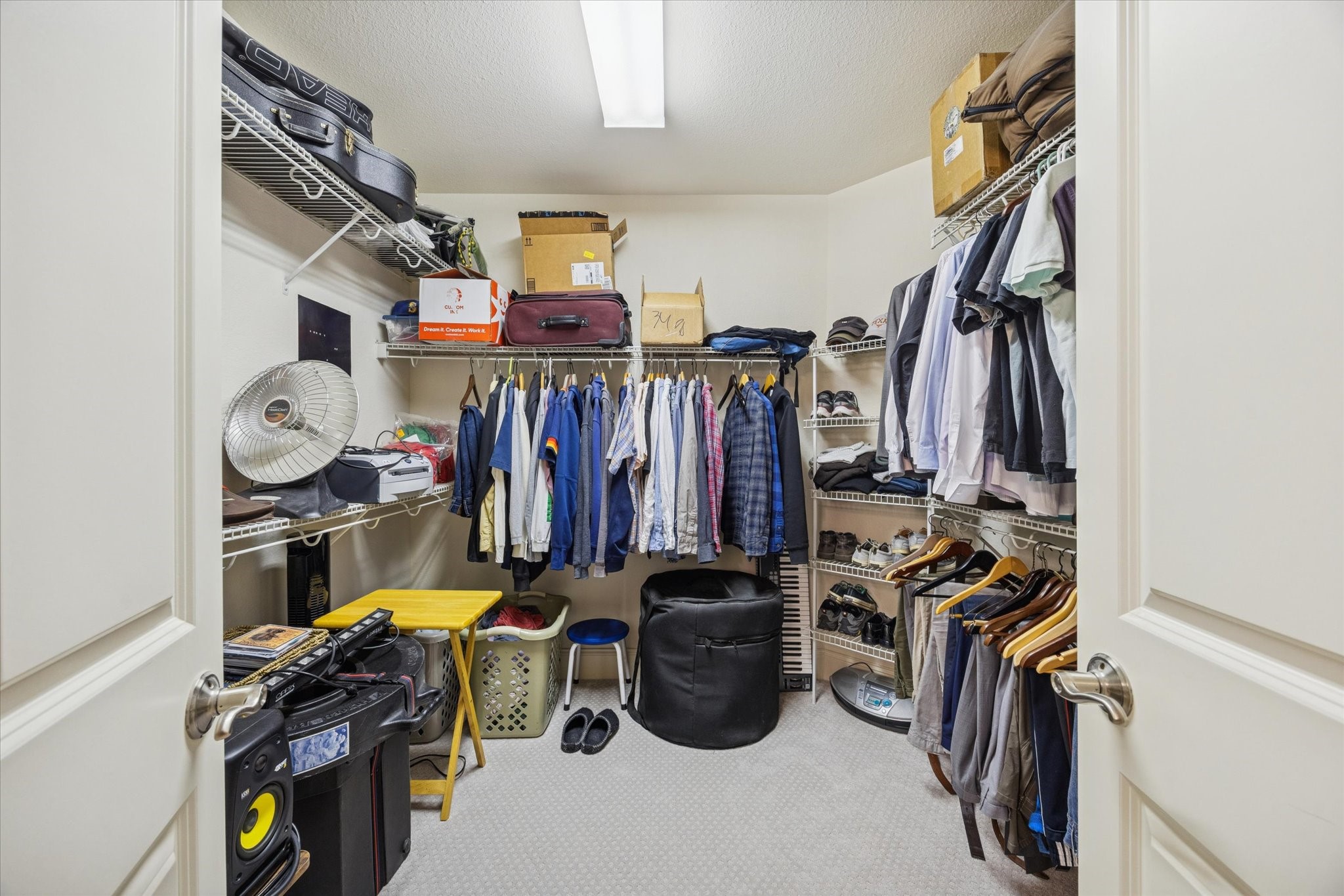 2120 Kipling Street, Unit 406 Houston, TX 77098 - Photo 16 of 19 a view of walk in closet with clothes and shoes