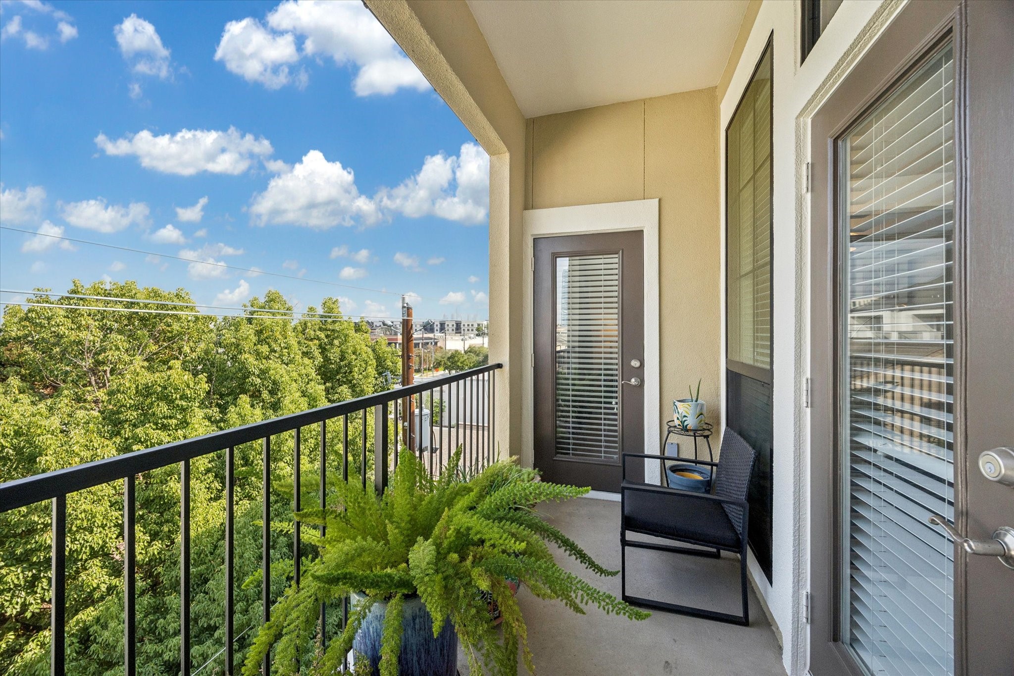 2120 Kipling Street, Unit 406 Houston, TX 77098 - Photo 17 of 19 a view of a balcony with chairs