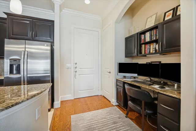 a kitchen with stainless steel appliances granite countertop a stove and a refrigerator