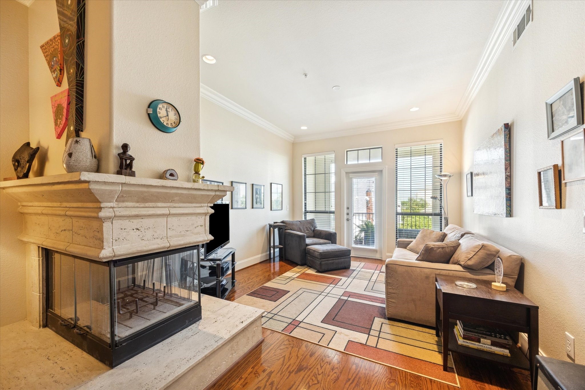 2120 Kipling Street, Unit 406 Houston, TX 77098 - Photo 6 of 19 a spacious bedroom with a bed a couch and a large window