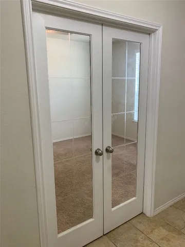 a bathroom with a glass door and shower