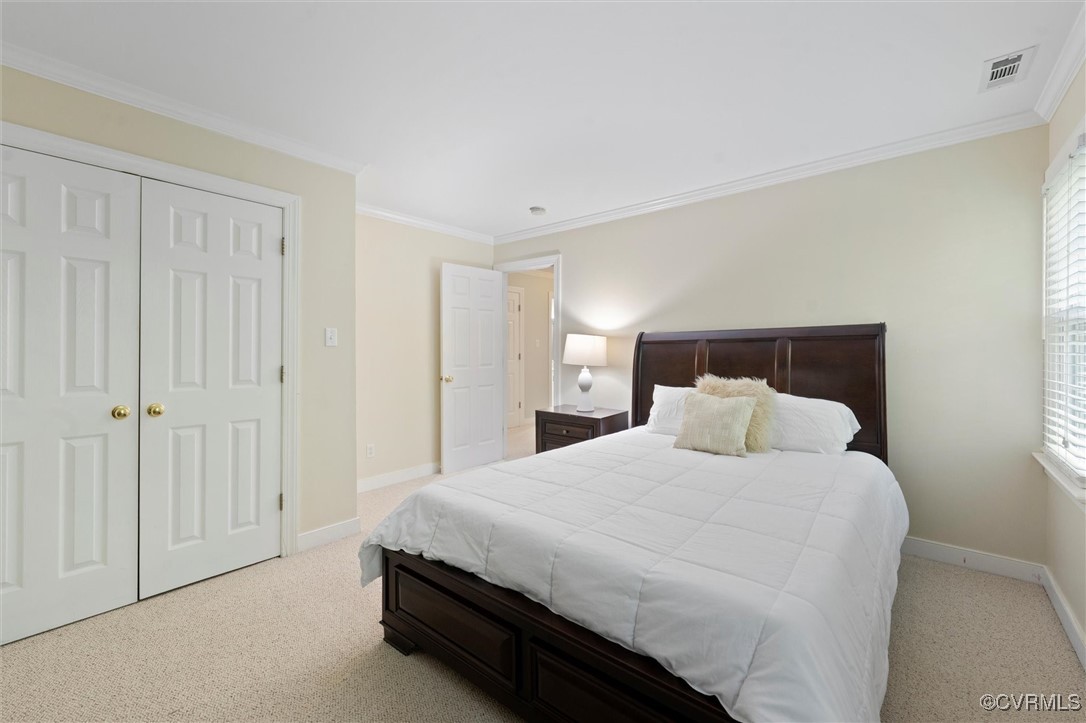 4107 Poplar Grove Road Midlothian, VA 23112 - Photo 13 of 38 a bedroom with a bed and a mirror