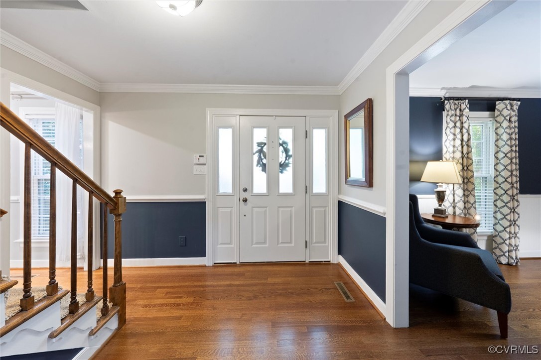 4107 Poplar Grove Road Midlothian, VA 23112 - Photo 21 of 38 a view of a hallway with wooden floor and livingroom with furniture