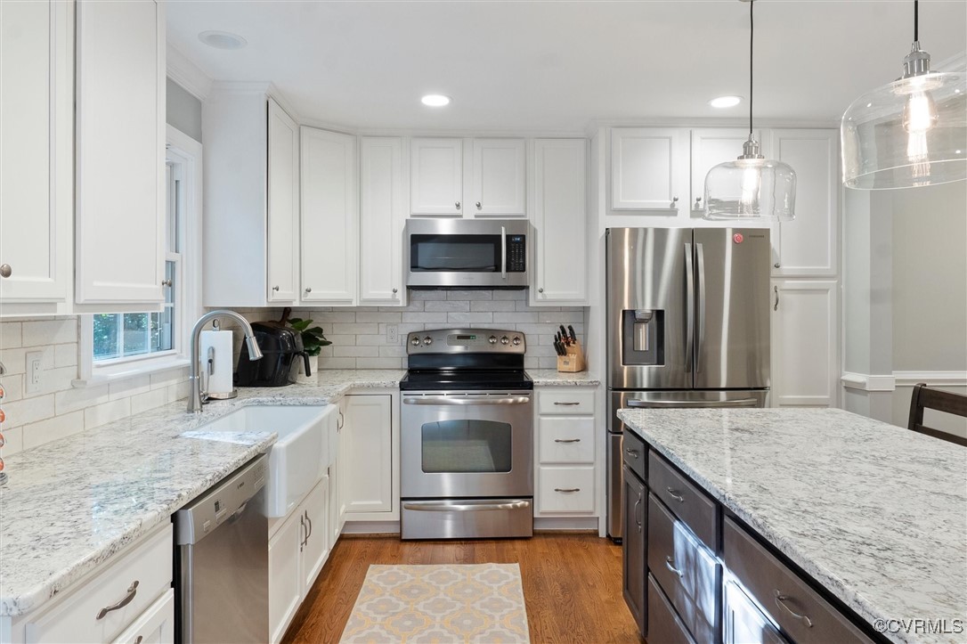 4107 Poplar Grove Road Midlothian, VA 23112 - Photo 24 of 38 a kitchen with a sink stove top oven and refrigerator