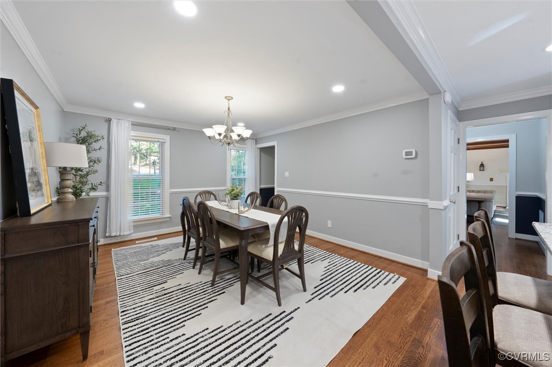 4107 Poplar Grove Road Midlothian, VA 23112 - Photo 28 of 38 a view of a dining room with furniture a chandelier and wooden floor