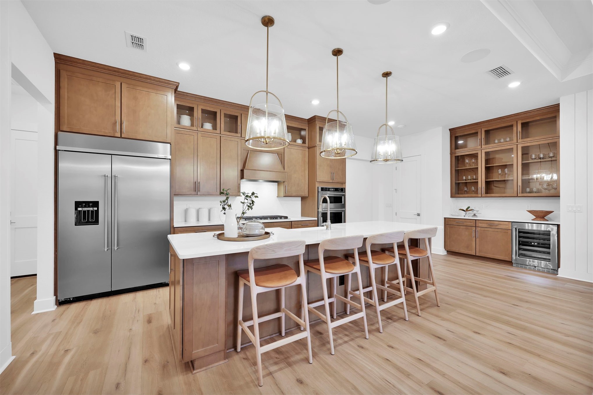 475 Pine Lilly Loop Yulee, FL 32097 - Photo 10 of 24 a kitchen with stainless steel appliances granite countertop a kitchen island hardwood floor and a sink
