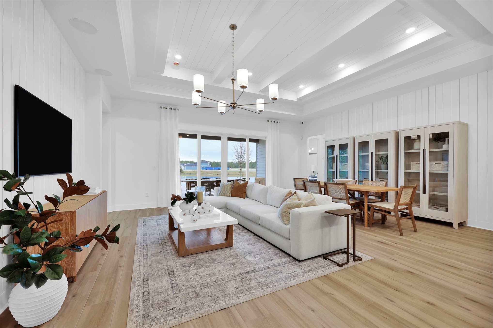 475 Pine Lilly Loop Yulee, FL 32097 - Photo 16 of 24 a living room with furniture flat screen tv and wooden floor