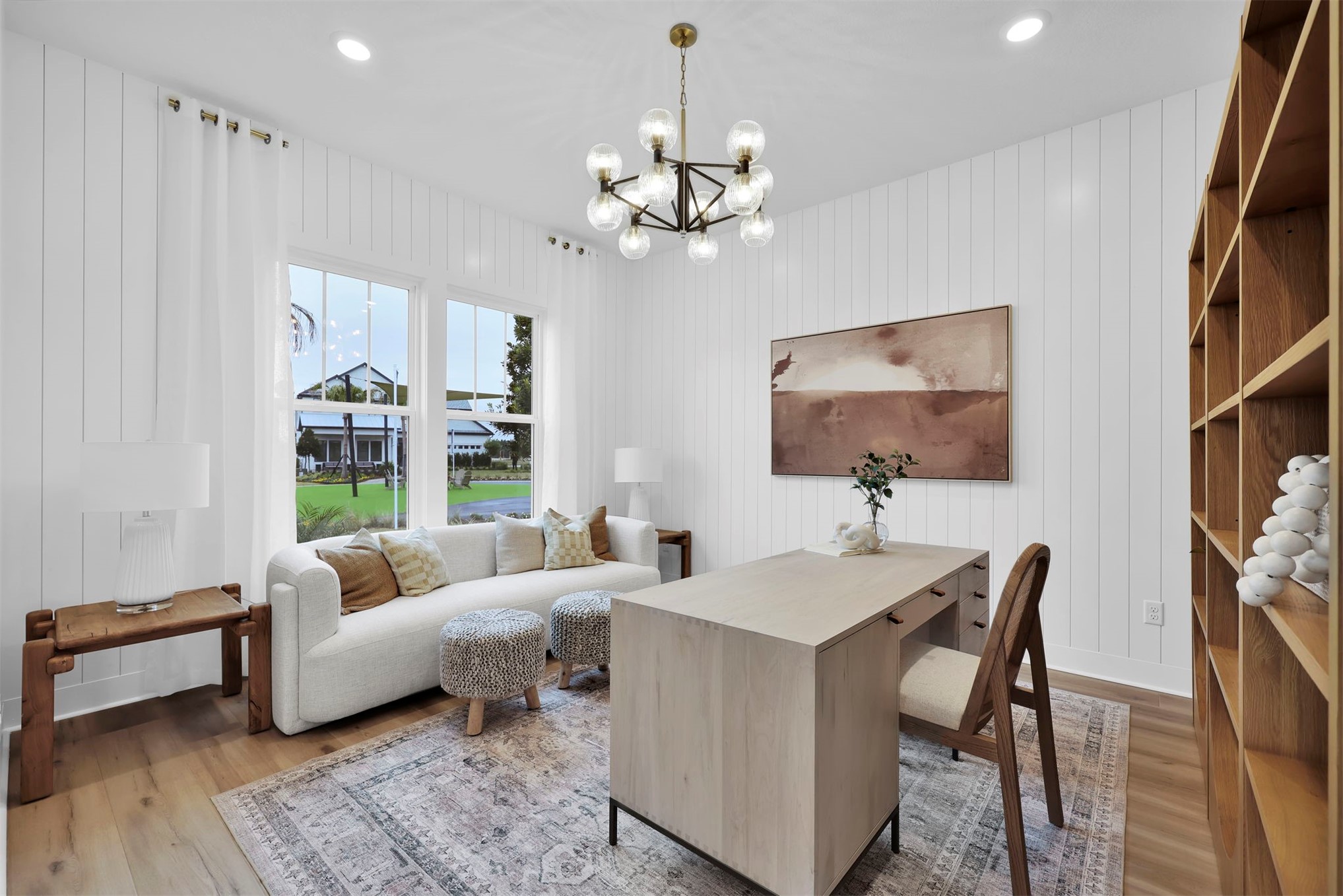 475 Pine Lilly Loop Yulee, FL 32097 - Photo 22 of 24 a living room with furniture a flat screen tv and a chandelier