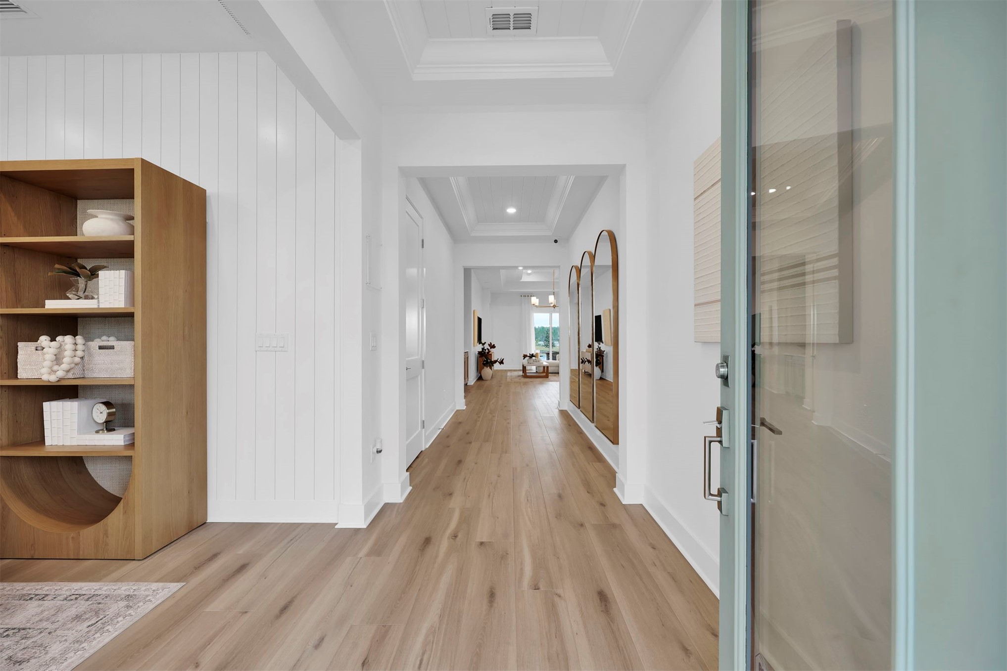475 Pine Lilly Loop Yulee, FL 32097 - Photo 4 of 24 a view of a hallway with wooden floor and staircase