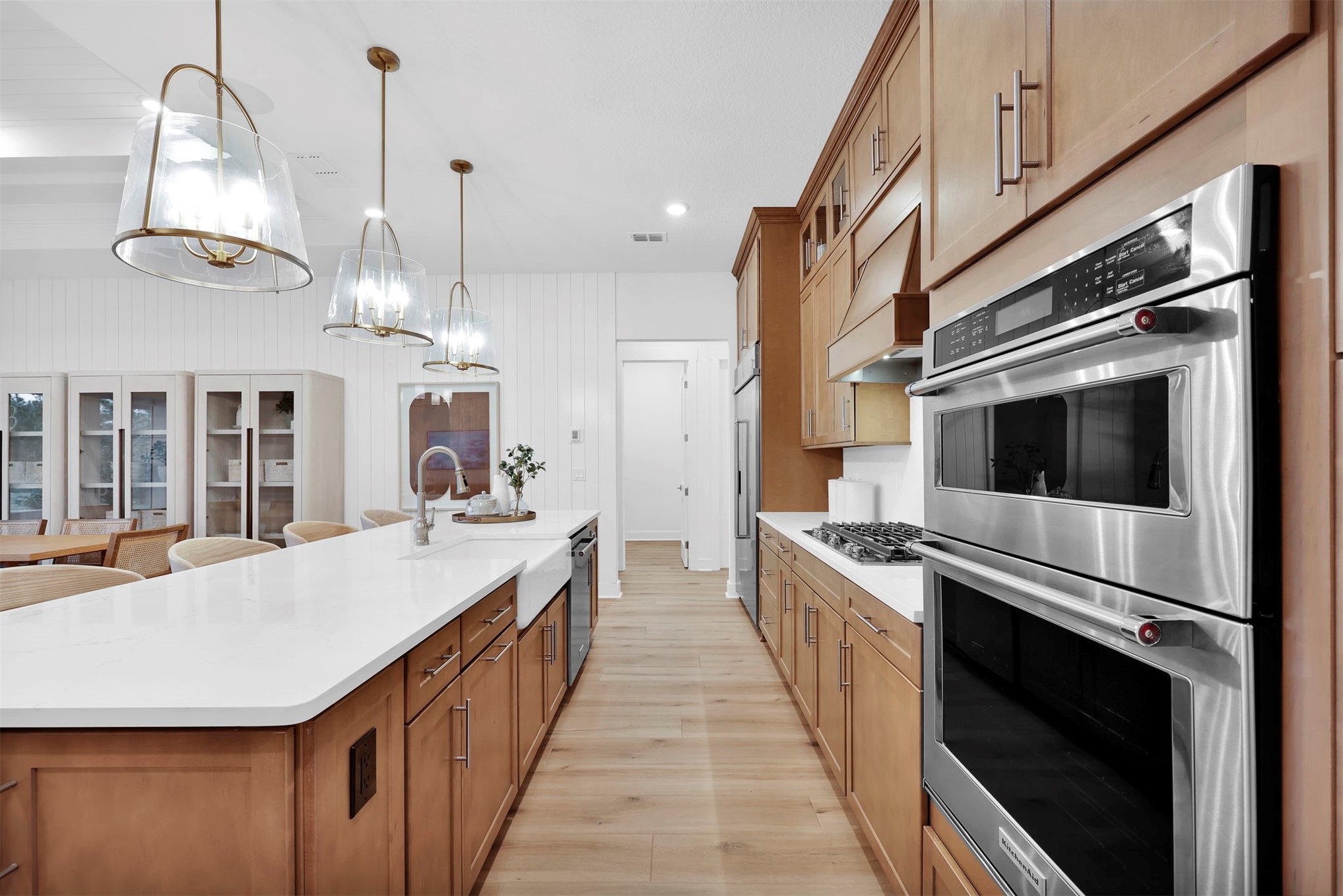 475 Pine Lilly Loop Yulee, FL 32097 - Photo 8 of 24 a large kitchen with stainless steel appliances kitchen island granite countertop a stove a sink and a refrigerator