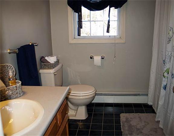 58 Allen Road Sturbridge, MA 01566 - Photo 11 of 18 a bathroom with a sink and a toilet