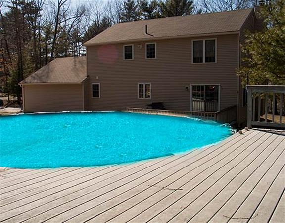 58 Allen Road Sturbridge, MA 01566 - Photo 15 of 18 a backyard of a house with wooden floor