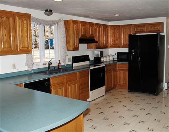 58 Allen Road Sturbridge, MA 01566 - Photo 6 of 18 a kitchen with stainless steel appliances granite countertop a stove a sink dishwasher a refrigerator and a oven