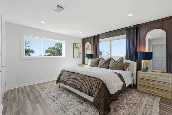 a bed room with a bed and a window