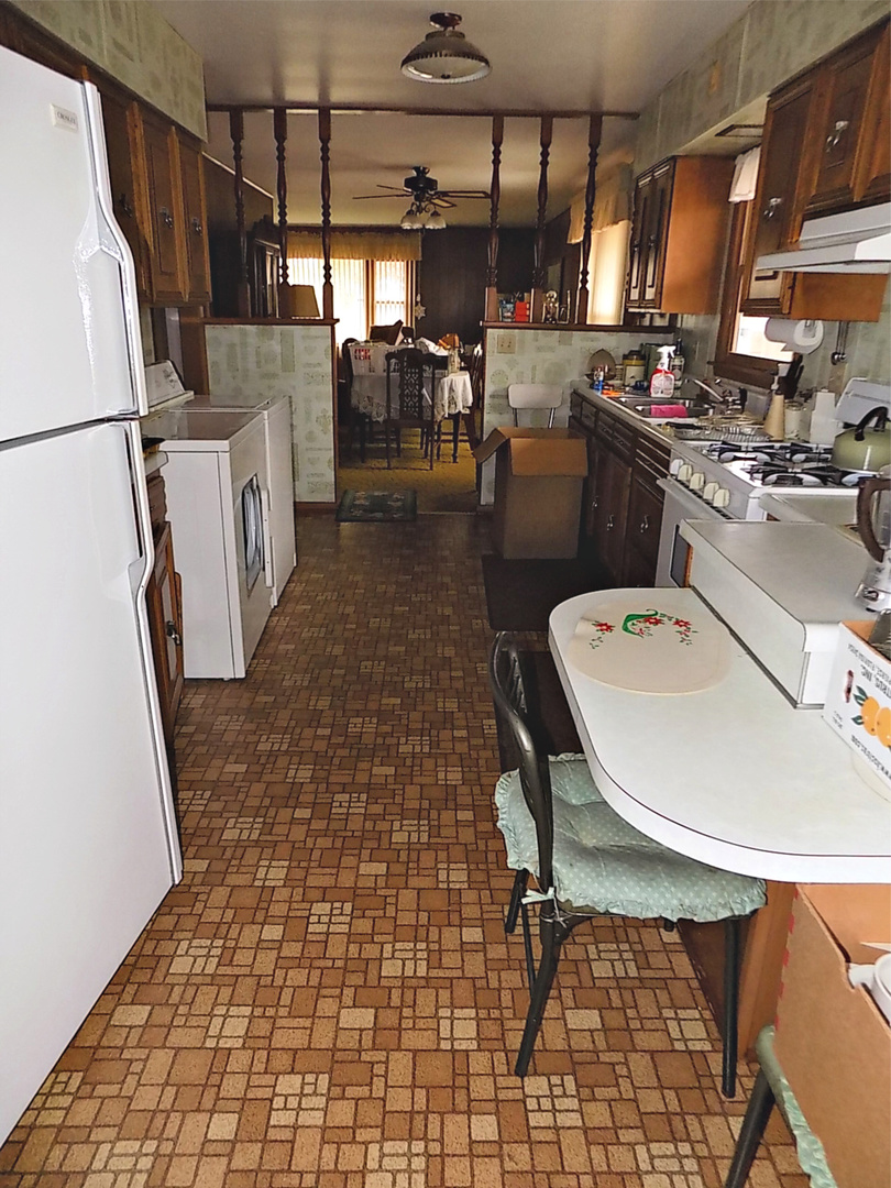 435 Sylvan Avenue Grand Ridge, IL 61325 - Photo 10 of 14 a kitchen with a sink a stove and a refrigerator