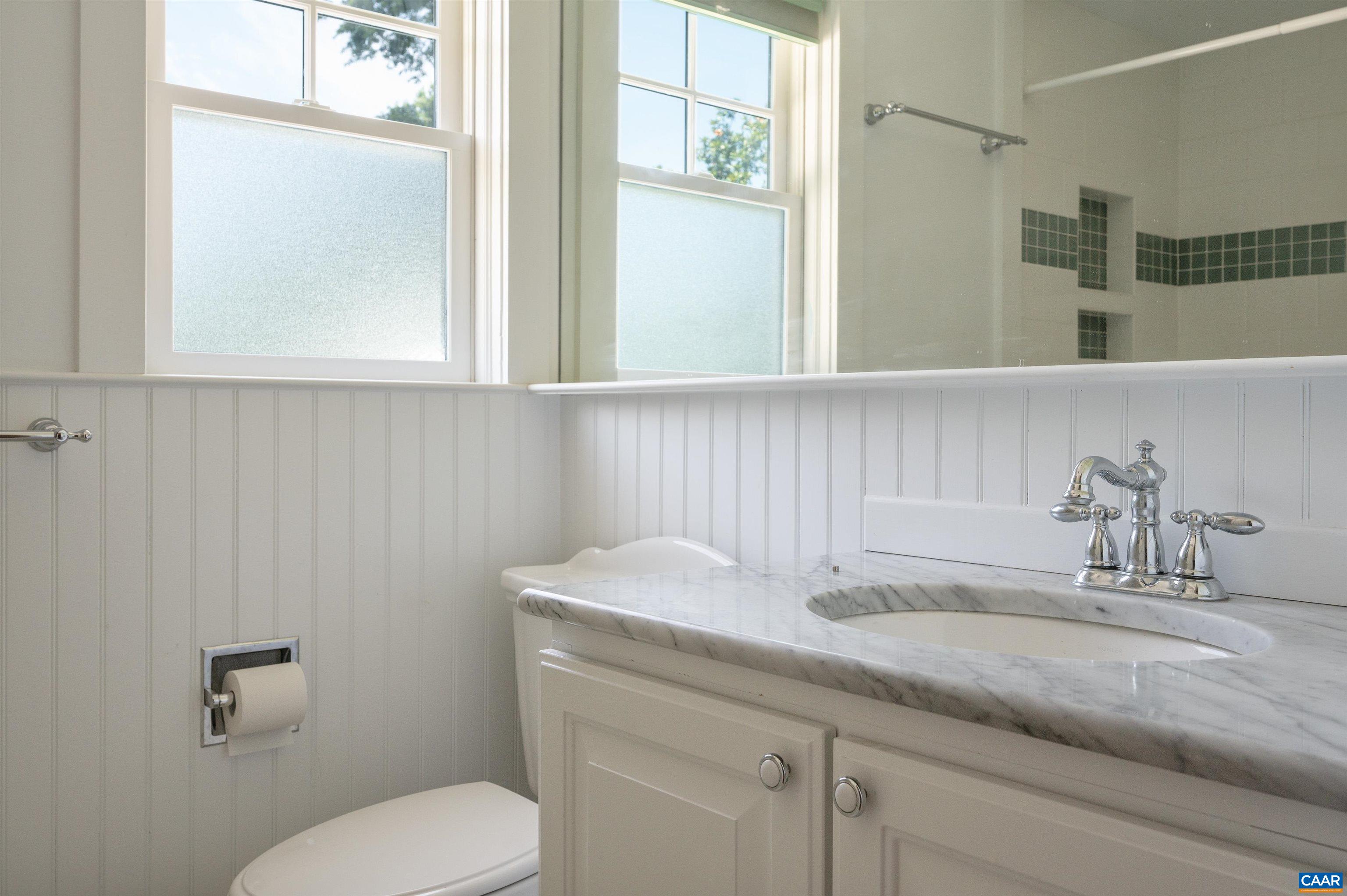 2845 Earlysville Road Earlysville, VA 22936 - Photo 15 of 35 a bathroom with a granite countertop toilet sink and mirror