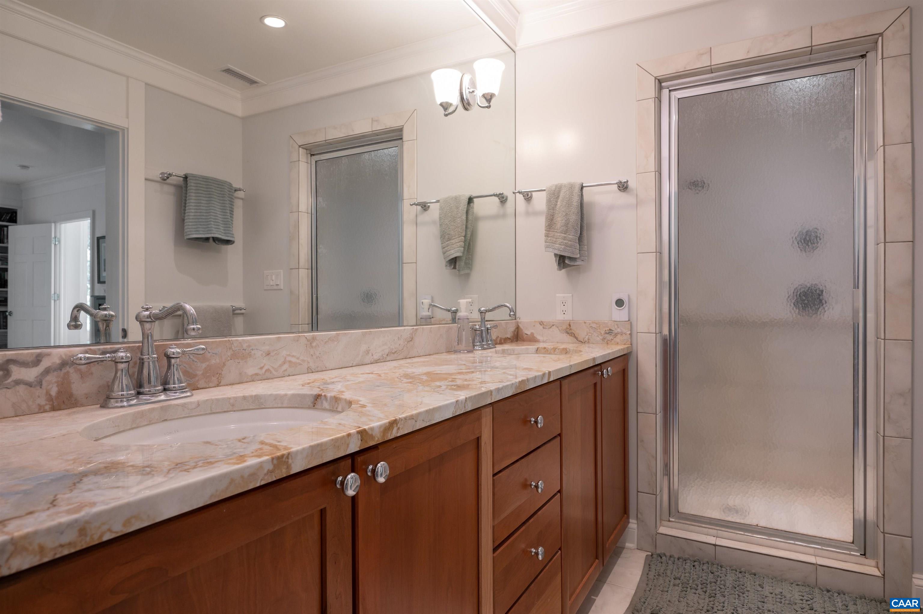 2845 Earlysville Road Earlysville, VA 22936 - Photo 20 of 35 a bathroom with a granite countertop sink a mirror and shower