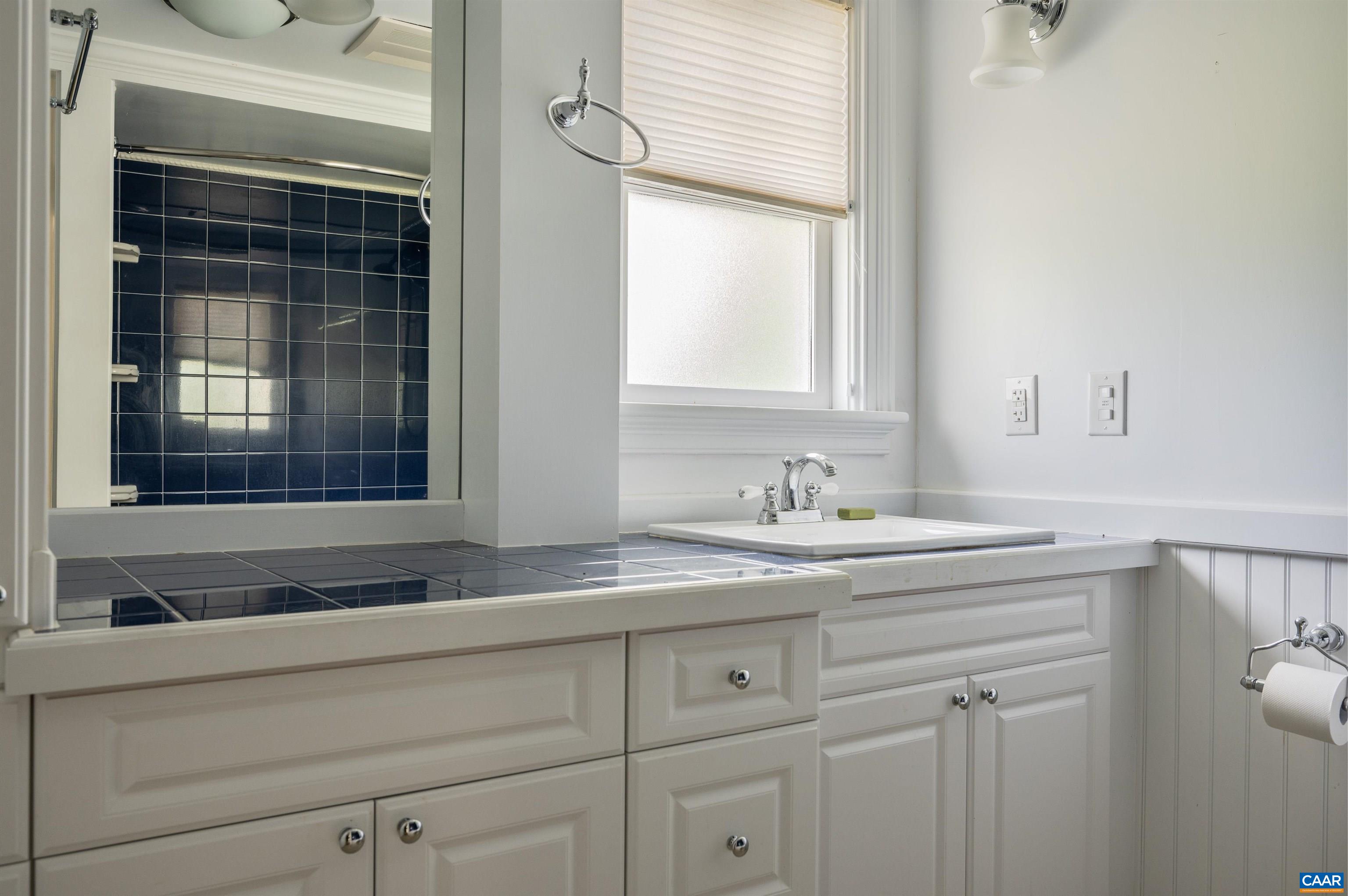 2845 Earlysville Road Earlysville, VA 22936 - Photo 27 of 35 a bathroom with a sink and a window