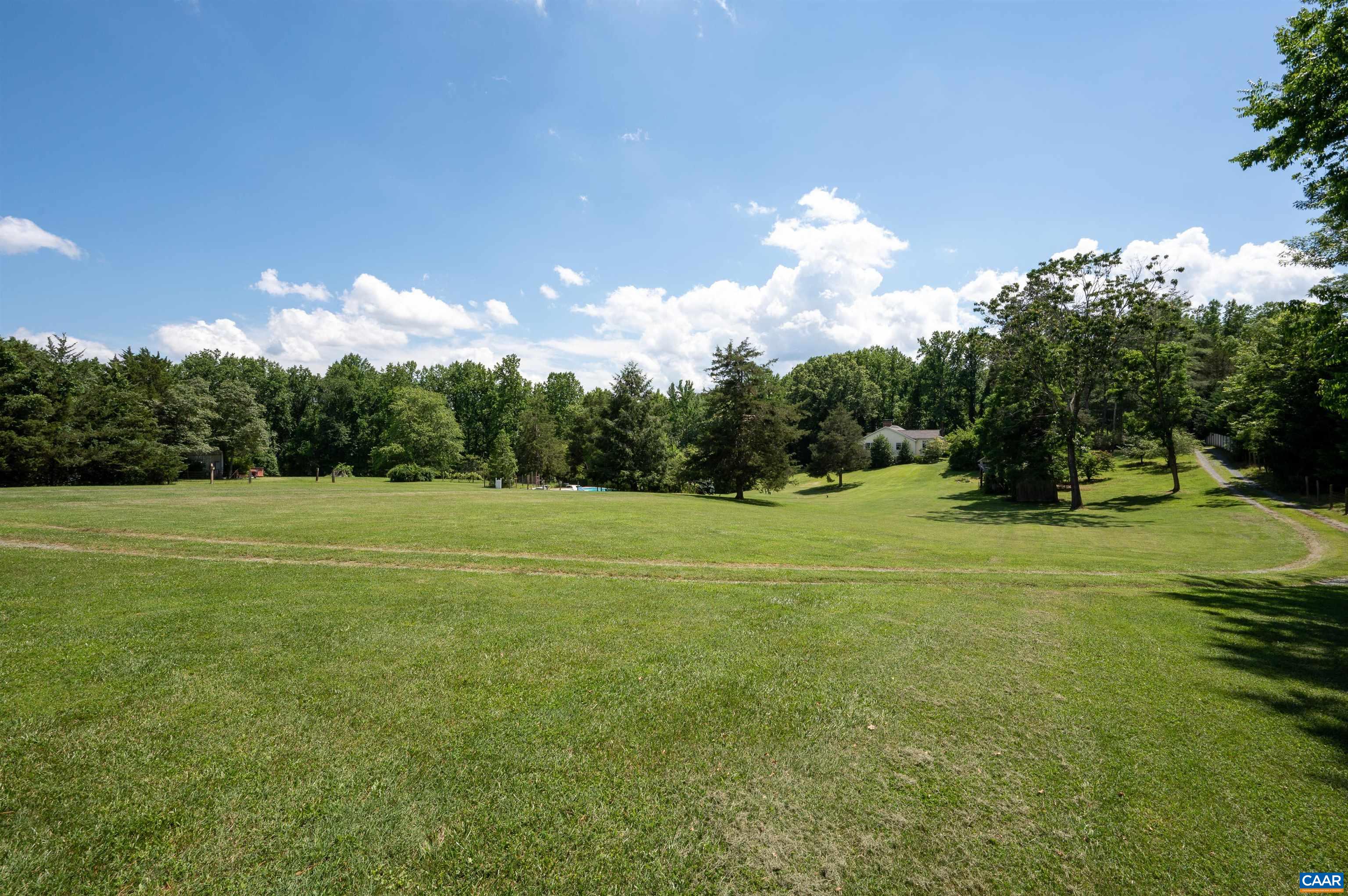 2845 Earlysville Road Earlysville, VA 22936 - Photo 35 of 35 a view of a golf course with a lake