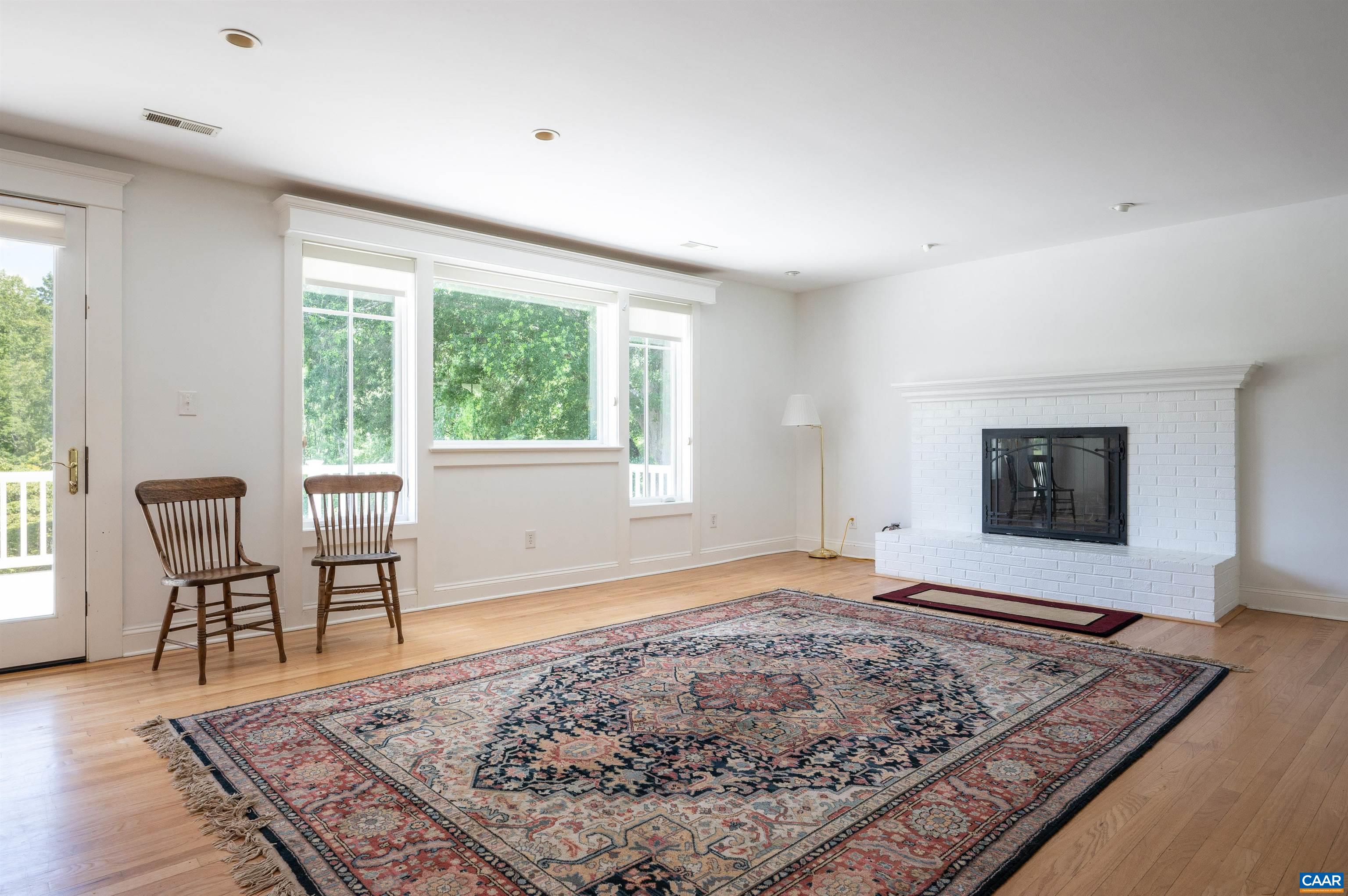 2845 Earlysville Road Earlysville, VA 22936 - Photo 5 of 35 a view of a livingroom with wooden floor and a rug