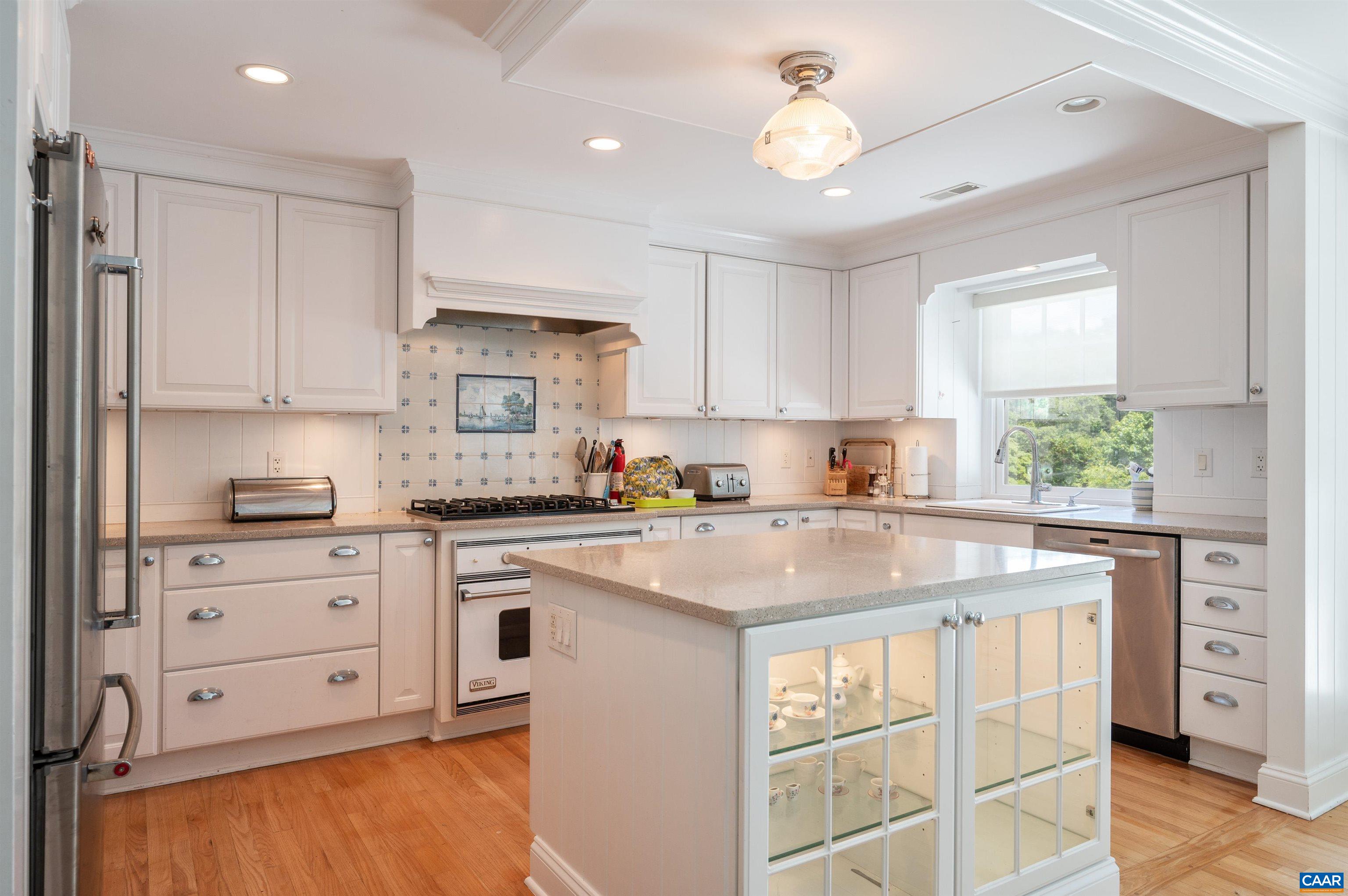 2845 Earlysville Road Earlysville, VA 22936 - Photo 6 of 35 a kitchen with stainless steel appliances granite countertop a stove a sink and dishwasher with white cabinets