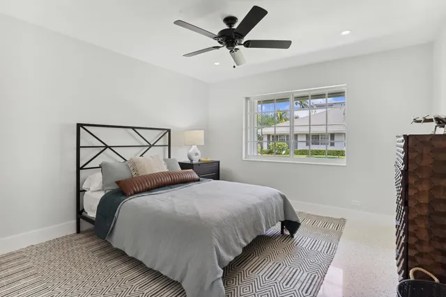 a bedroom with bed and a window