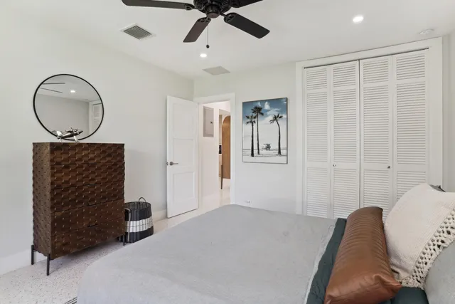 a living room with furniture a air conditioner vent and a chandelier