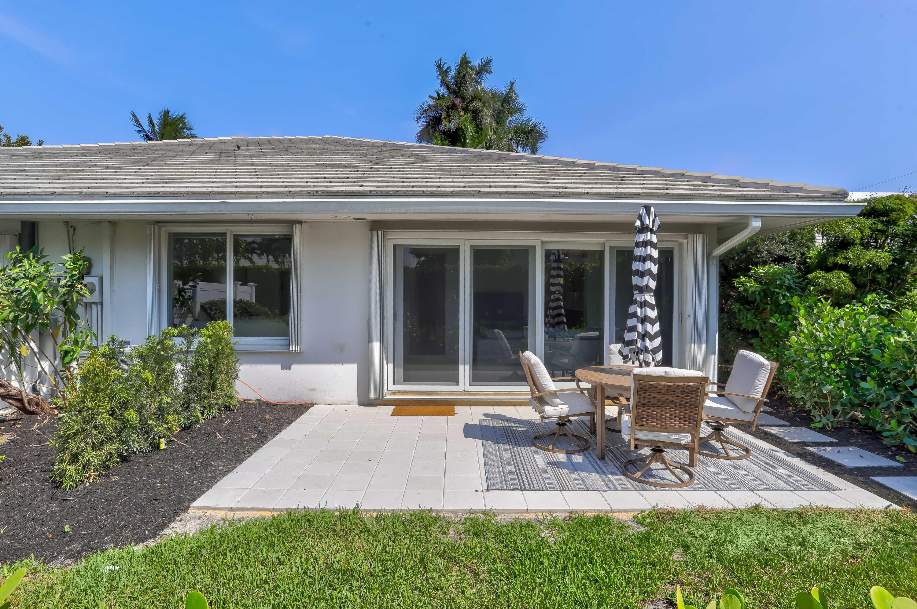 1004 Langer Way Delray Beach, FL 33483 - Photo 16 of 19 a view of a house with porch and garden