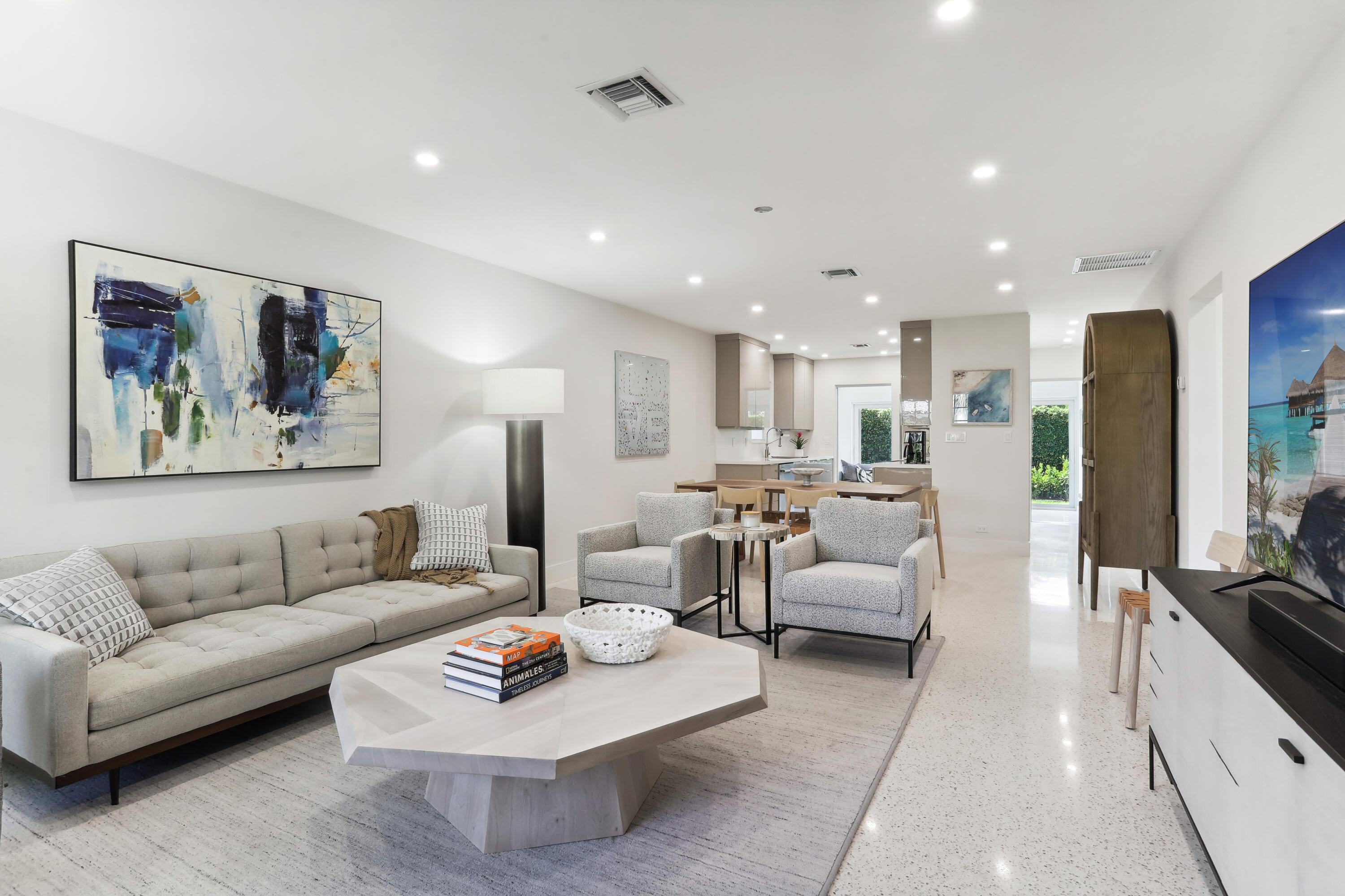 1004 Langer Way Delray Beach, FL 33483 - Photo 4 of 19 a living room with furniture and a dining table with kitchen view