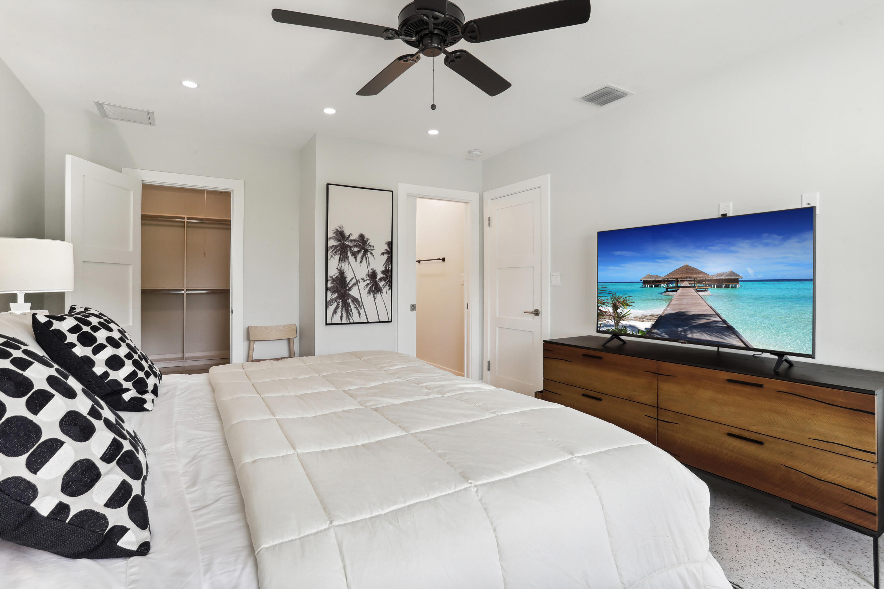 1004 Langer Way Delray Beach, FL 33483 - Photo 9 of 19 a bedroom with a bed and a chandelier