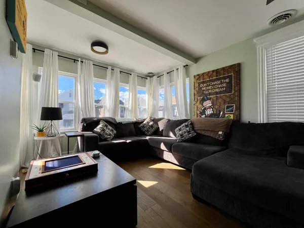 a living room with furniture and a large window