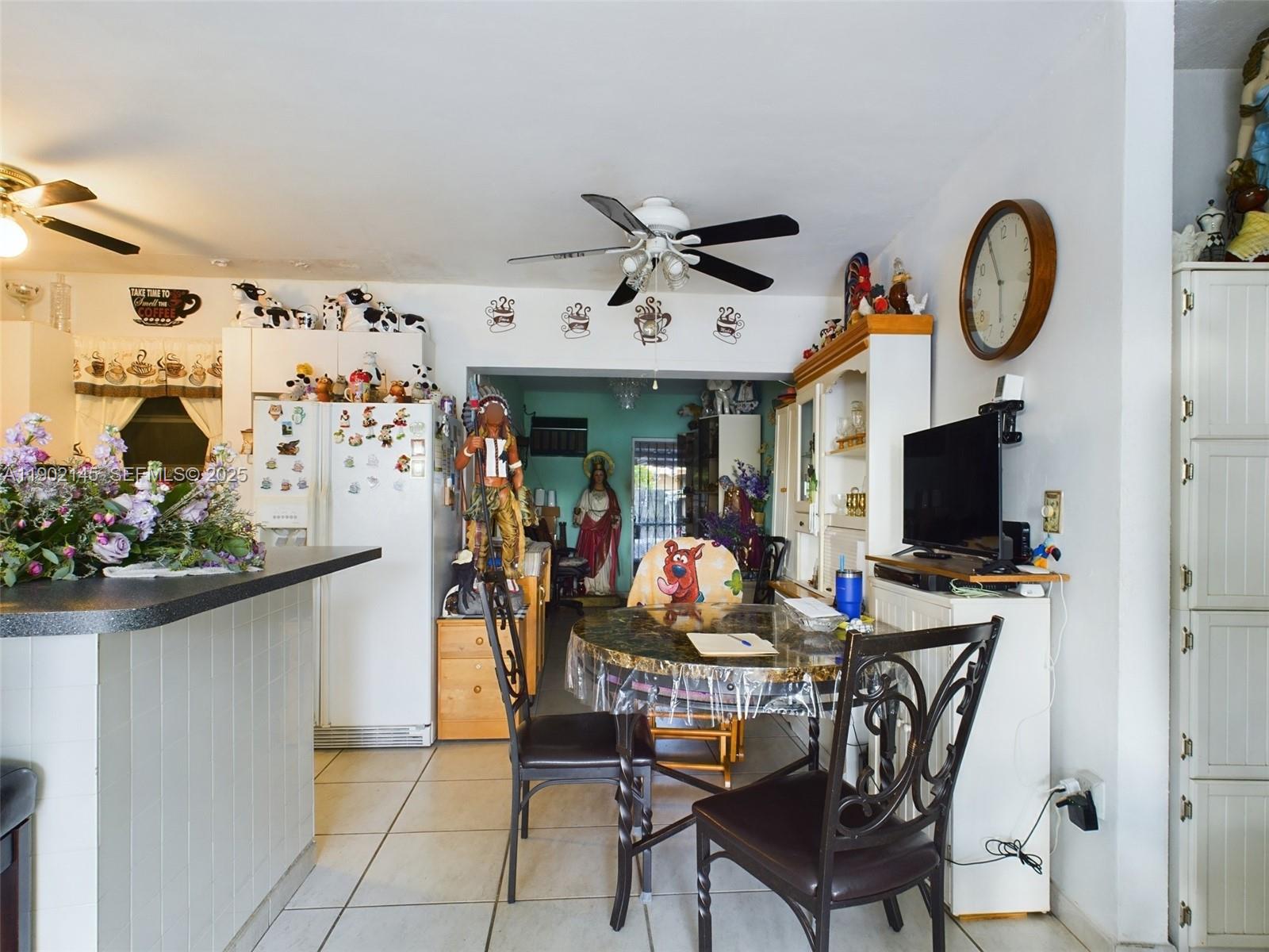 3861 Northwest 177th Street Miami Gardens, FL 33055 - Photo 14 of 15 a view of a livingroom with furniture and a fan