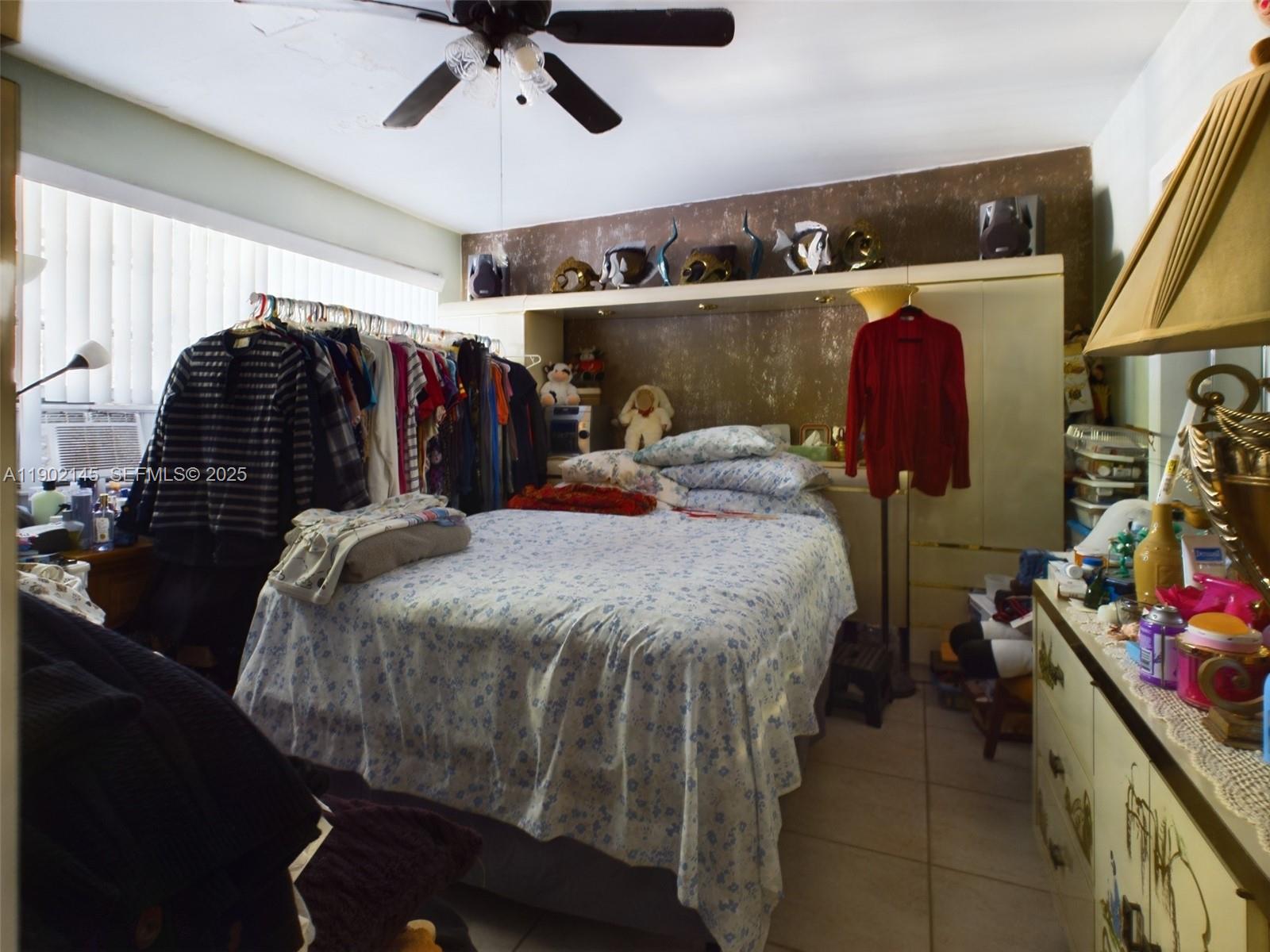 3861 Northwest 177th Street Miami Gardens, FL 33055 - Photo 15 of 15 a bed room with a bed and a walk in closet