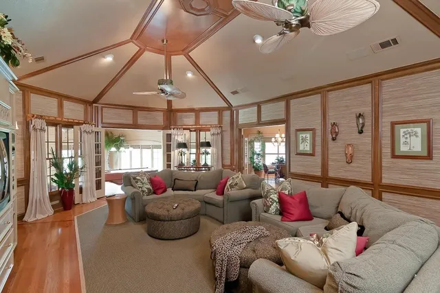a very nice looking dining room with kitchen island wooden floor and a large window